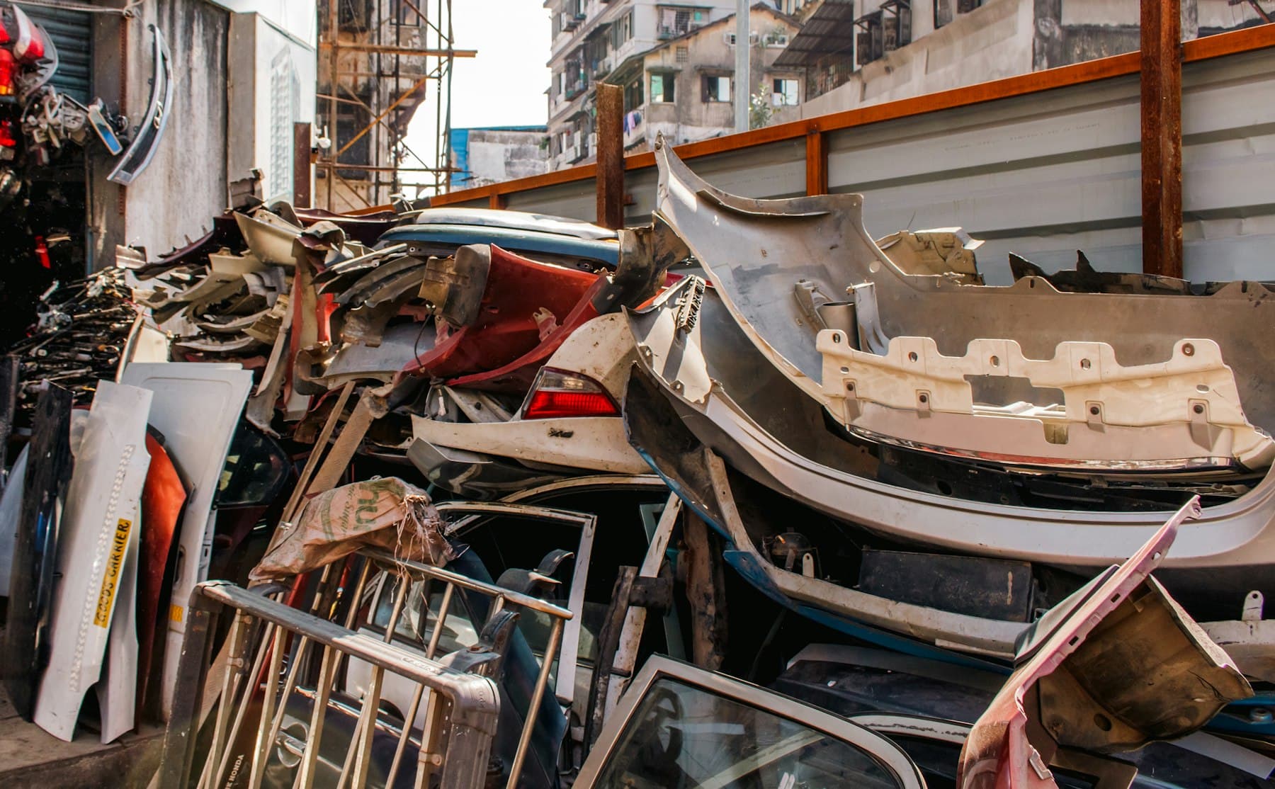 A pile of scrap metal and vehicle parts at an Indian scrap market